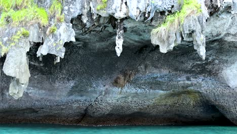 rock formations above clear blue sea in krabi