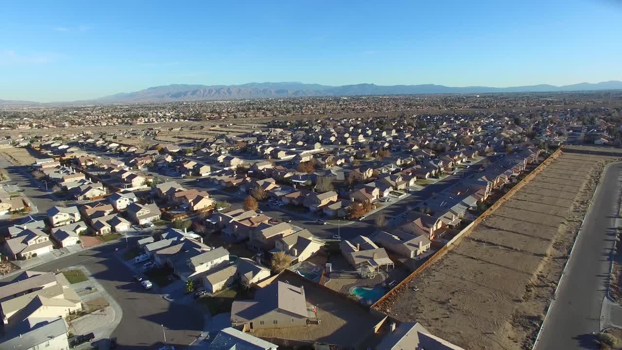 Aerial over desert reveals housing tracts in the desert 1