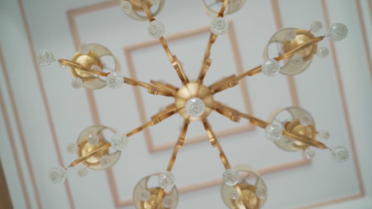 A ceiling decorated by Chandelier, close up shot