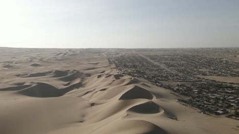 angled light and shadows form surreal desert landscape at ica peru