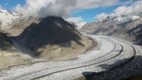 slow pan right while flying towards the aletsch glacier, switzerland during the day in summer