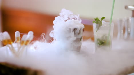 puffs of dry smoke coming out of a drink
