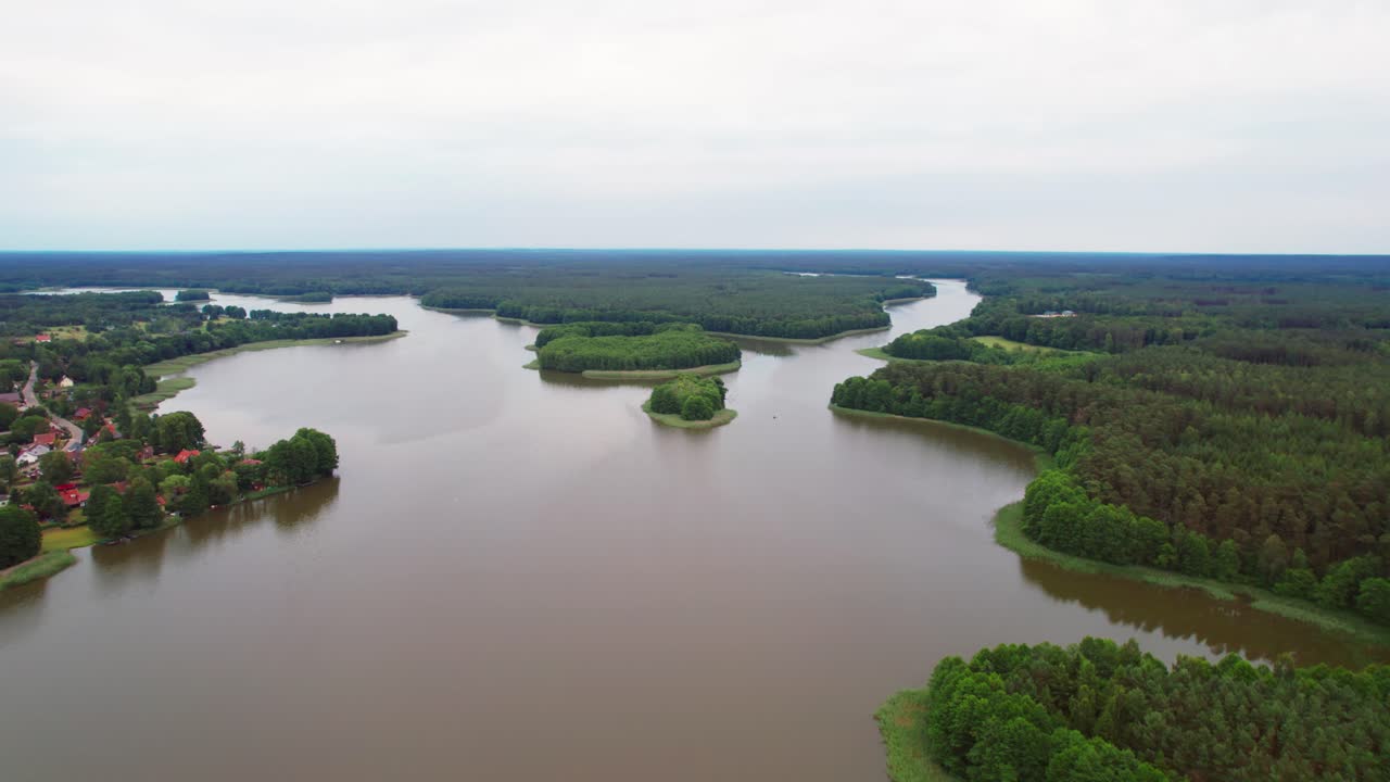 Aerial view of wild lake and forest in Masuria