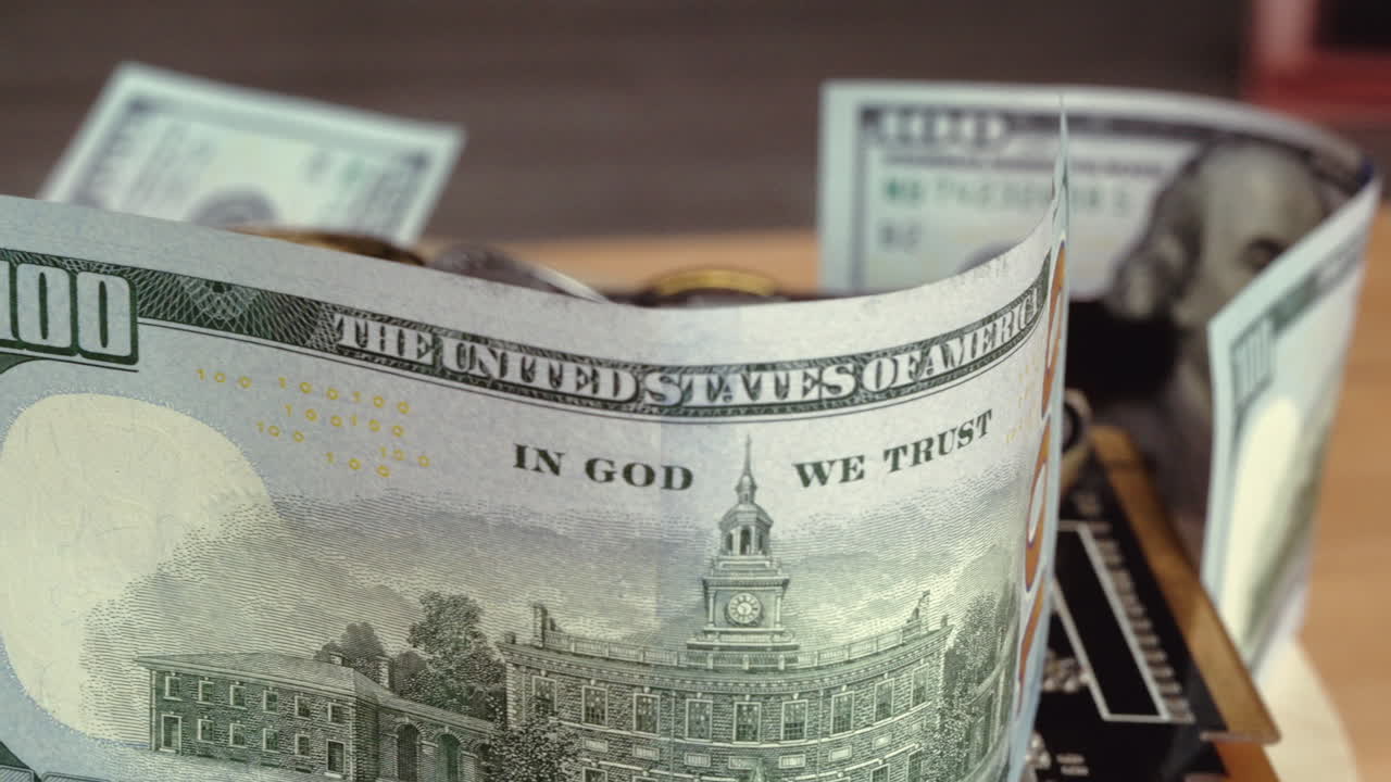 Composition with golden and silver bitcoin crypto money, dollars and computer graphic mining cards