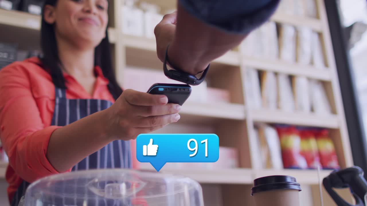 Barista placing cup, patron tapping watch near phone causing floating like counter for cafe payment