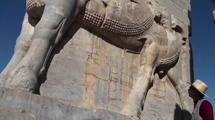 A bas relief carved in stone in the ruins of the ancient city of Persepolis in Iran 1