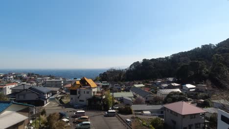 Slow-motion-view-of-fishing-town-next-to-ocean