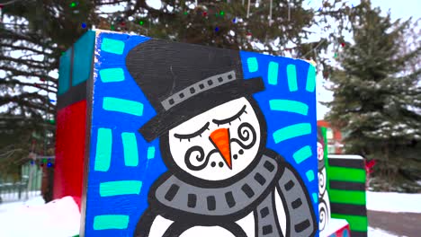 close up of a snowman painted in a public park for the winer holidays