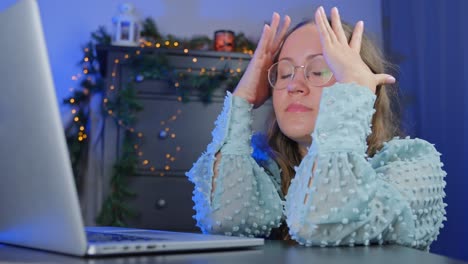 overwhelmed girl at laptop, buying last minute presents for christmas