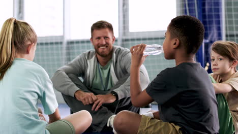 Man-and-children-sitting-on-the-floor