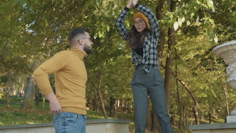 Young-Female-And-Male-Friends-Joking-And-Laughing