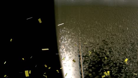 Animation-of-gold-confetti-falling-and-bubbles-rising-in-glass-of-champagne-on-black-background