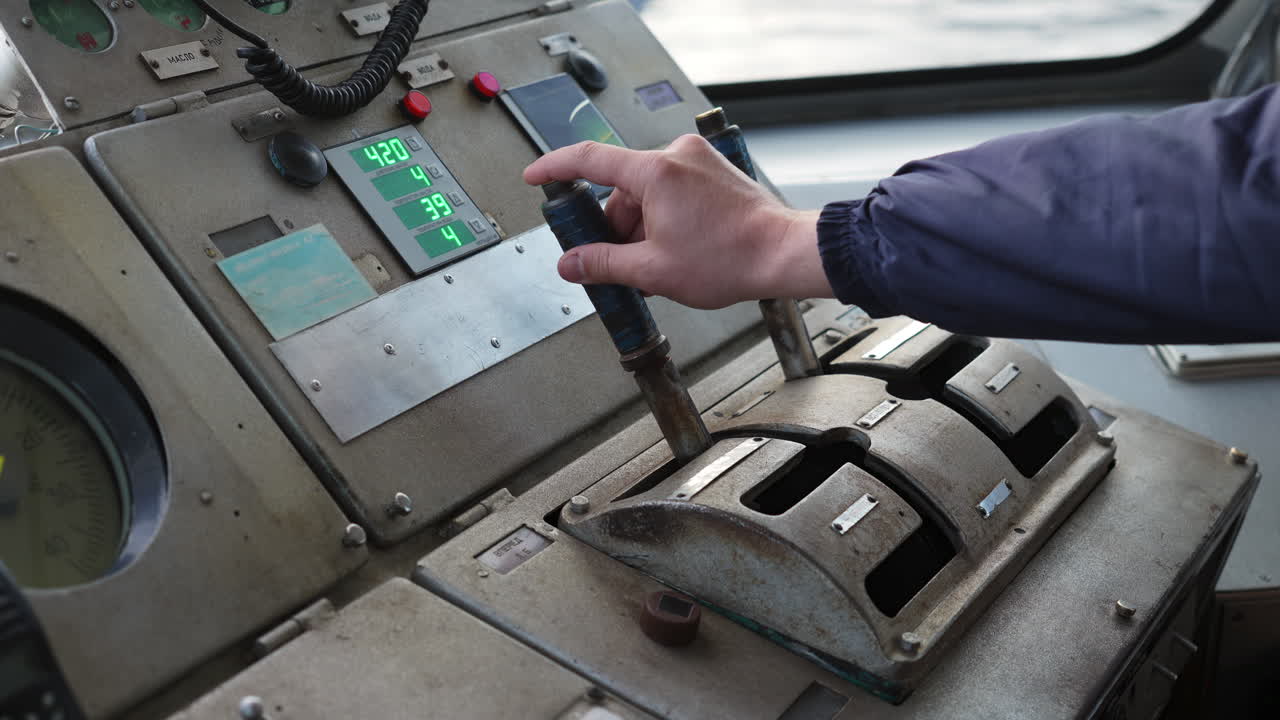 Operating the control panel of a ship