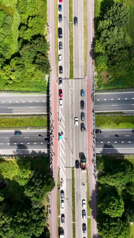 Aerial View of a Highway Interchange with Traffic and Spectators on an Overpass