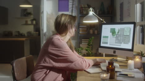 female designer working at home in cozy atmosphere
