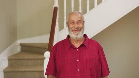 Senior-man-smiling-at-home