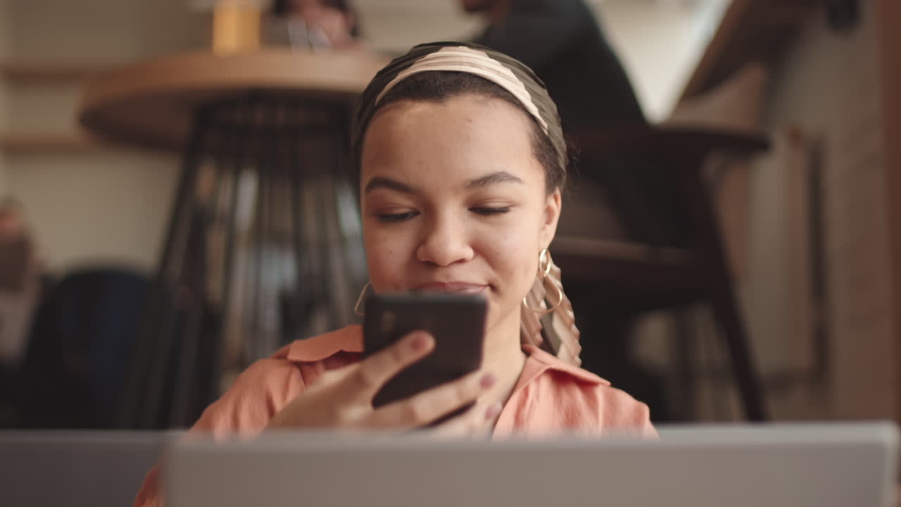 Female Freelancer Working in Cafe