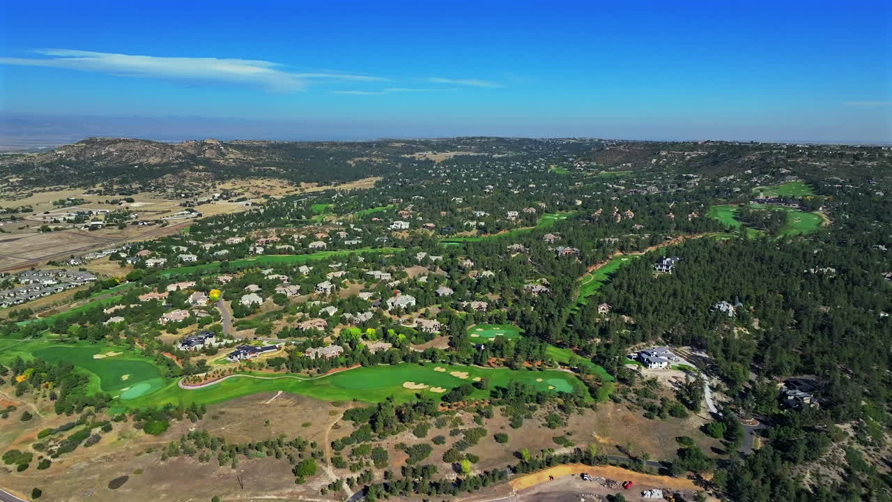 Sedalia Daniels Park Castle Pines Village North Ridge Golf Course spring summer aerial drone Denver Colorado front range sunrise morning i25 Highlands Ranch homes green grass backwards pan up