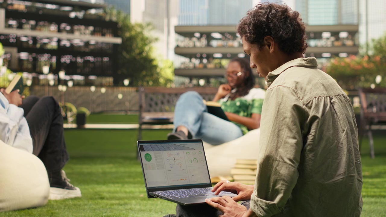 Student working with renewable energy data on laptop