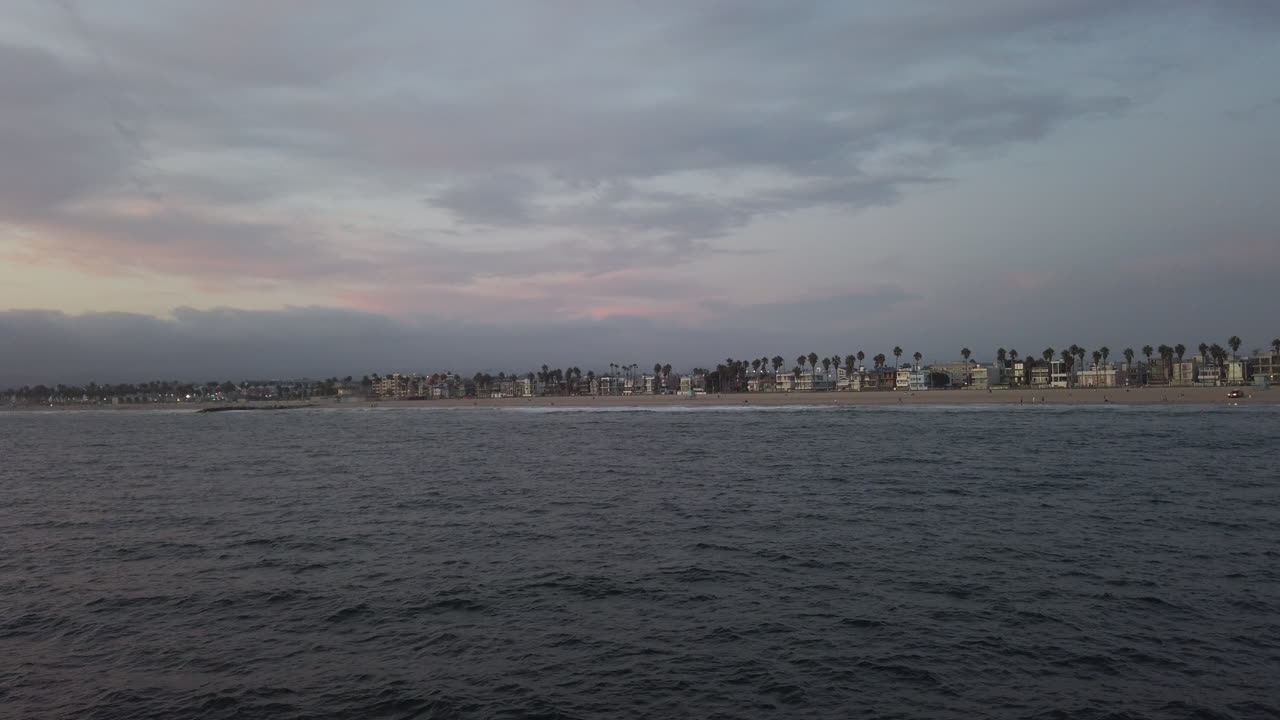 Beautiful sunset near the coastline. The sea reflecting the cloudscape