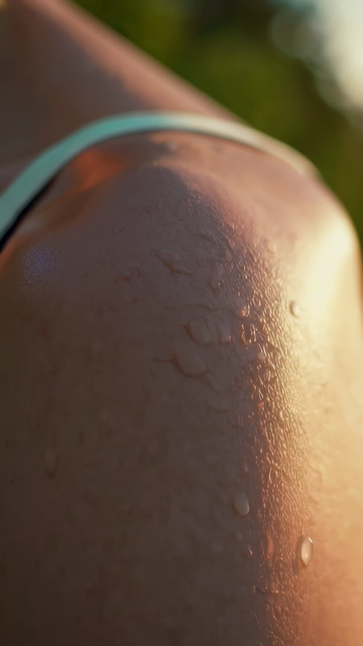 Close-up of Skin with Water Droplets in Warm Sunlight