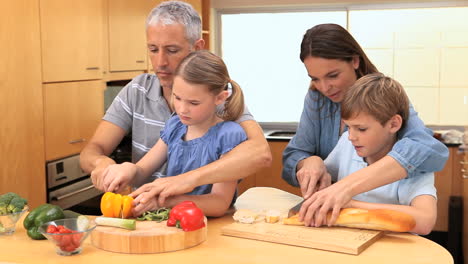 smiling family cooking together