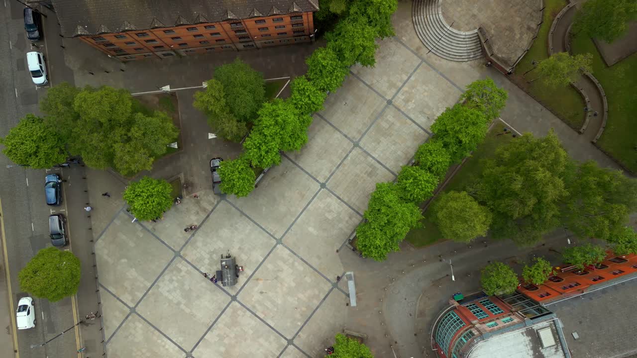 Rising aerial video of Writer's Square and St Anne's Cathedral in The Cathedral Quarter in Belfast, Northern Ireland, UK. Filmed in 4K, 60FPS and with Rec709 Color.