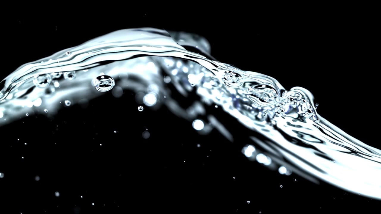 Slow Motion Close-Up of Clear Water Wave with Bubbles on Black Background