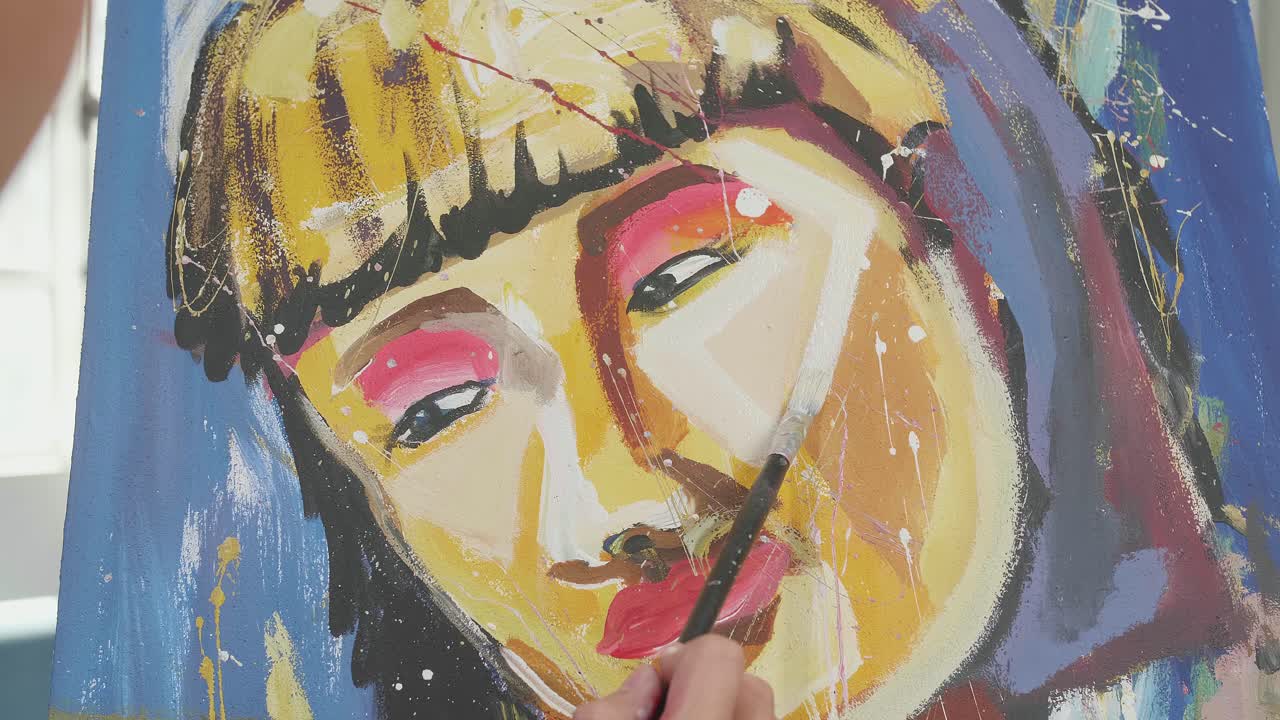 Close Up Of An Asian Artist Man Holding Paintbrush Mixed Colour And Painting A Girl'S Face On The Canvas