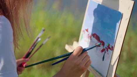 woman painting outdoors