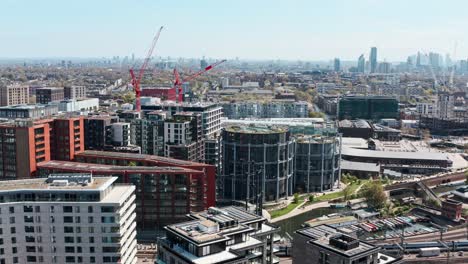 overhead drone shot of gasholder apartments and park kings cross london