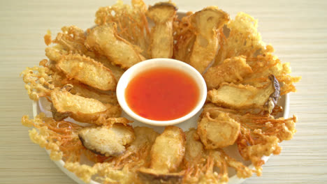 deep fried enoki mushroom and king oyster mushroom with spicy dipping sauce - vegan food style