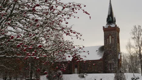 snow covered gärdhems christian old stone nordic church establisher - sweden