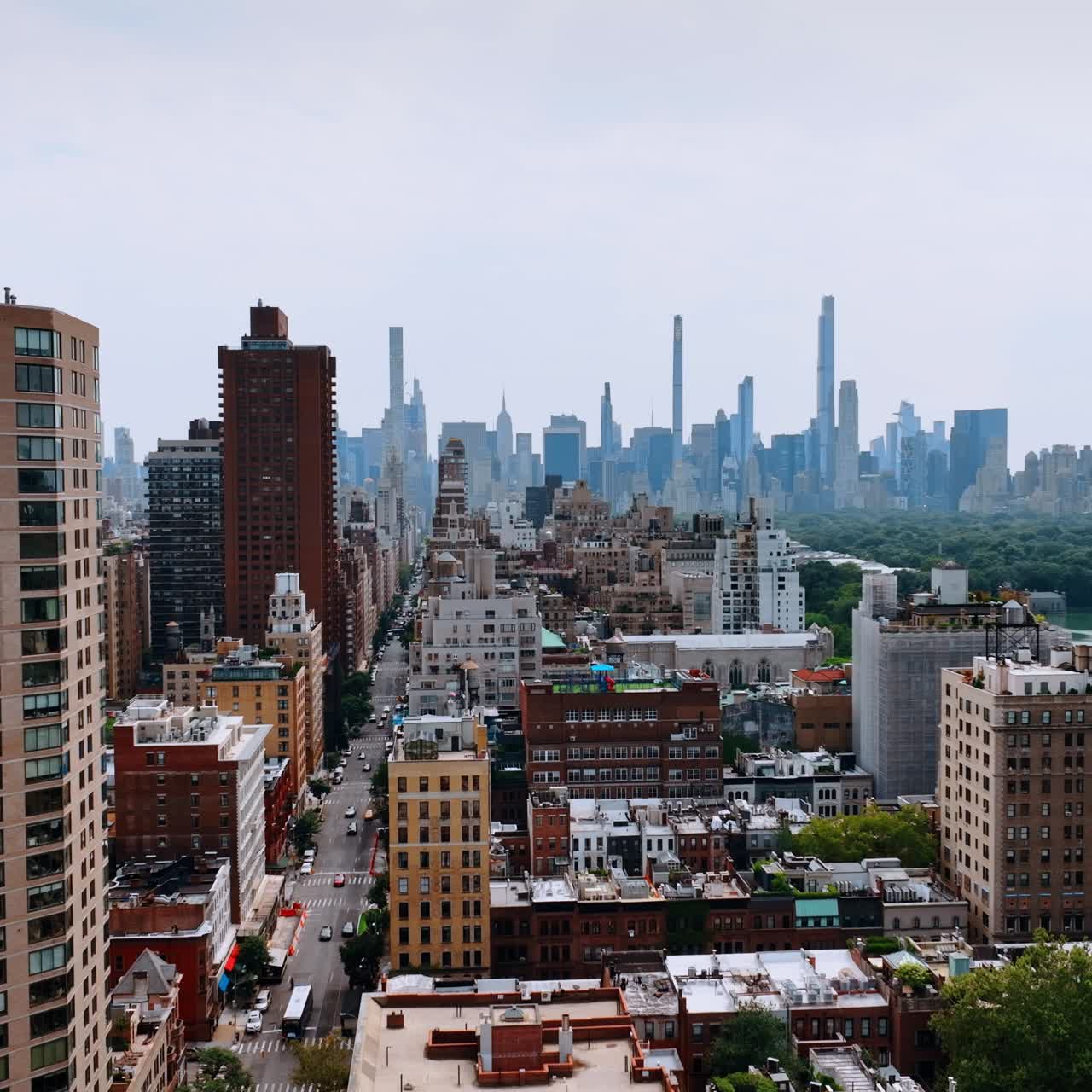 Bright New York cityscape on beautiful sunny day. Skyscrapers skyline at backdrop. Top view