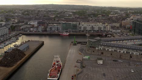 golden hour at galway docks: ships and scrap mountain