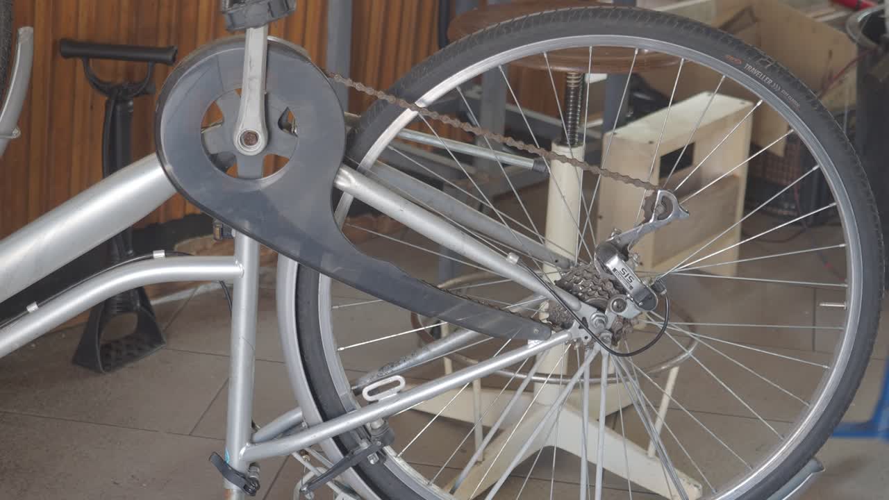 bicycle repair shop scene featuring a mountain bike mounted on a stand for maintenance and service highlighting mechanical components and accessories in a bicycle shop environment