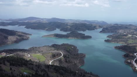 Slow-cinematic-aerial-shot-of-the-impressive-lake-Plastira-in-central-Greece,-with-nice-shore-formations-|-4K