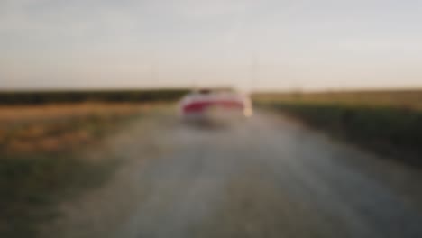 video of couple drives away in a red convertible