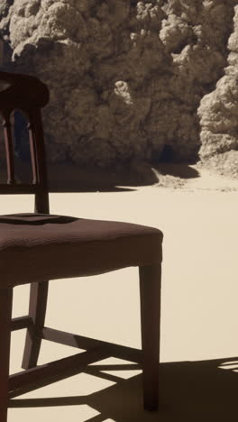 a solitary wooden chair in a desert landscape