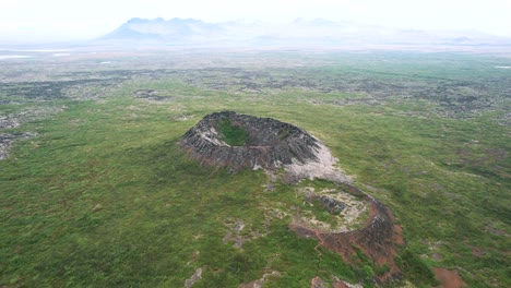 crater iceland aerial drone overview shot, panoramic movement, icelandic landmark, hiking trail, sporty travel destination, nordic walking, geology tourism