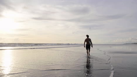 Young-man-with-surfboard