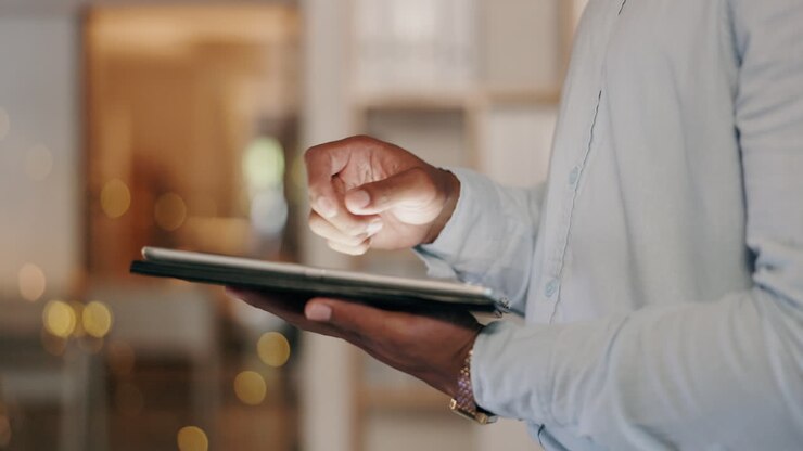 Business, man and hands scroll on tablet in office