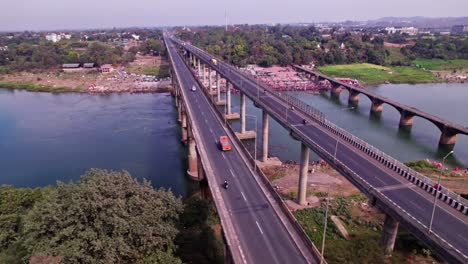 narmada bridge with narmada river and vehicles at jotpur, jabalpur, madhya pradesh, india. day time, semi orbit, drone shot, 4k.