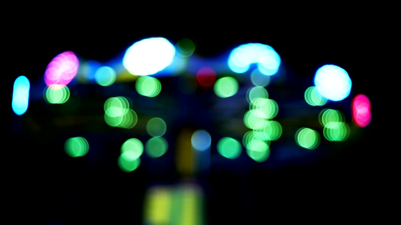 parque de atracciones bokeh por la noche