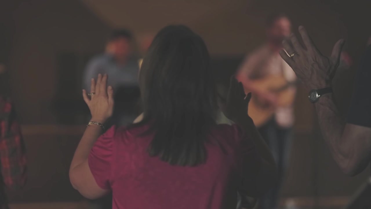 People Raising Hands in Worship or Prayer at a Spiritual Gathering