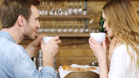 couple having coffee at counter 4k