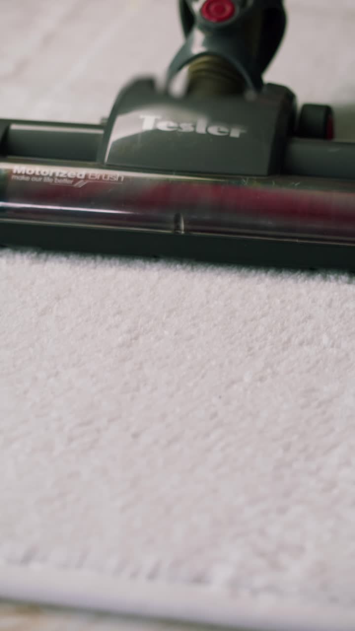 Vacuum Cleaner Head Cleaning a White Fluffy Carpet