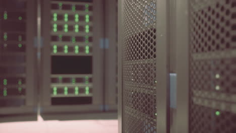 Shot-of-Corridor-in-Working-Data-Center-Full-of-Rack-Servers-and-Supercomputers