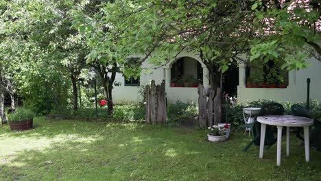 cozy countryside cottage with a garden surrounded by trees