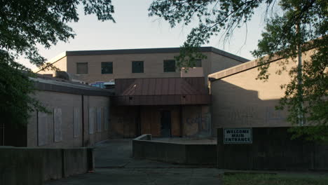 tilt down to boarded up school